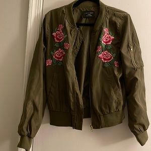 Army green bomber jacket with embodied rose flowers on it